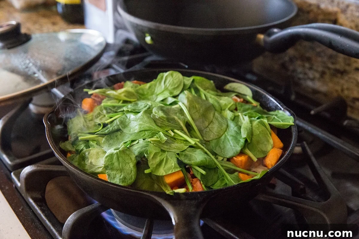 Cook the spinach into the hash