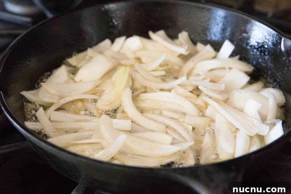 Cook the onion in the bacon fat
