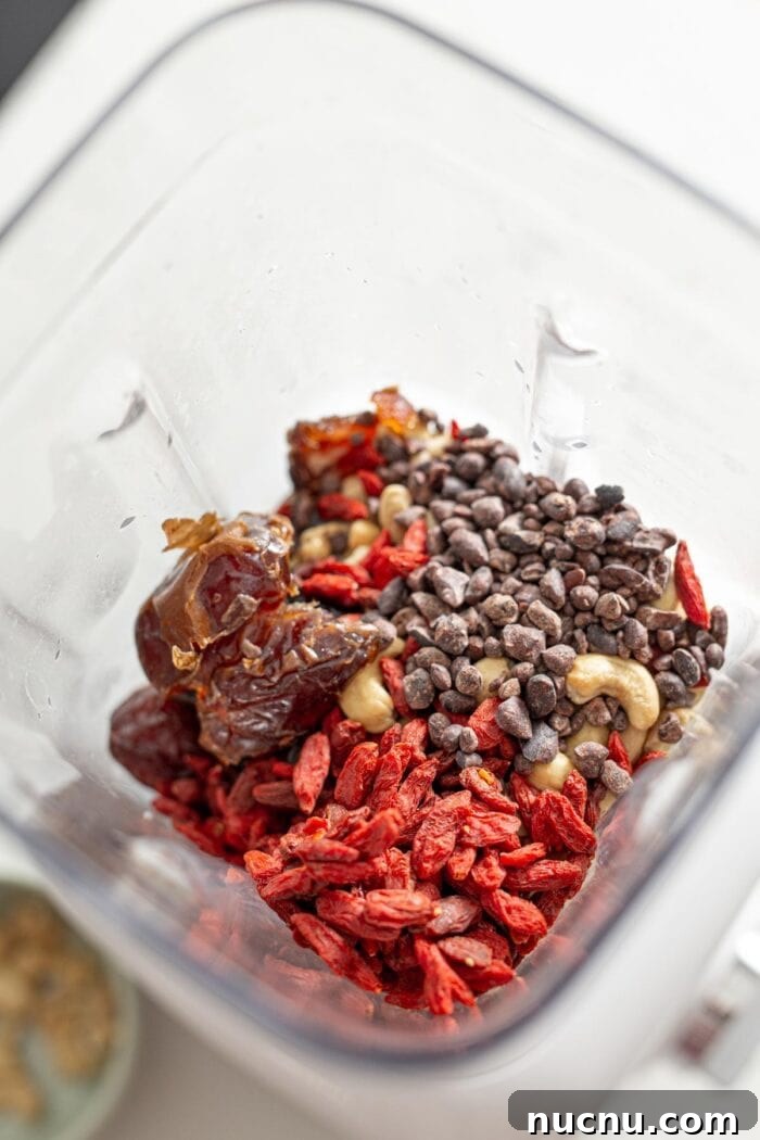 Essential Vegan Pantry Staples for Everyday Cooking 11 Goji berries, dates, cashews and cacao nibs in a blender.