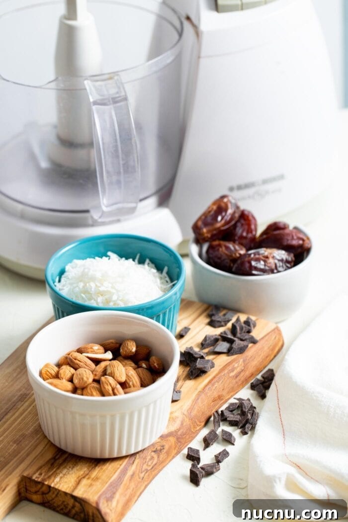 Essential Vegan Pantry Staples for Everyday Cooking 6 Almonds, coconut, dates and chocolate chips in containers on a countertop.
