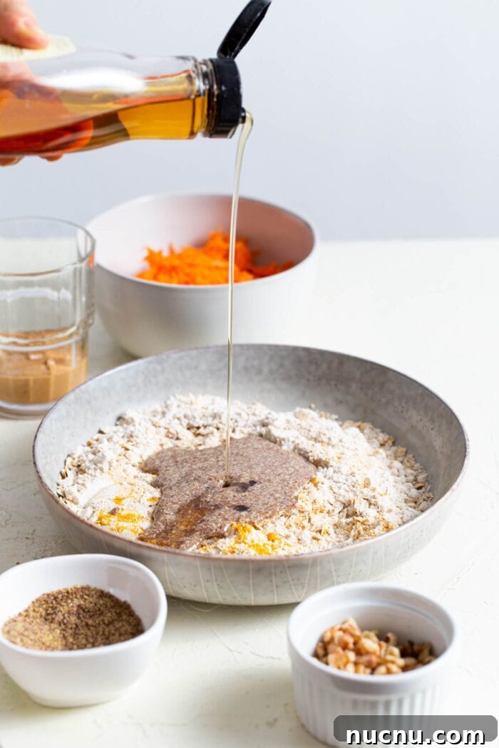 Essential Vegan Pantry Staples for Everyday Cooking 9 Syrup being poured into a bowl.
