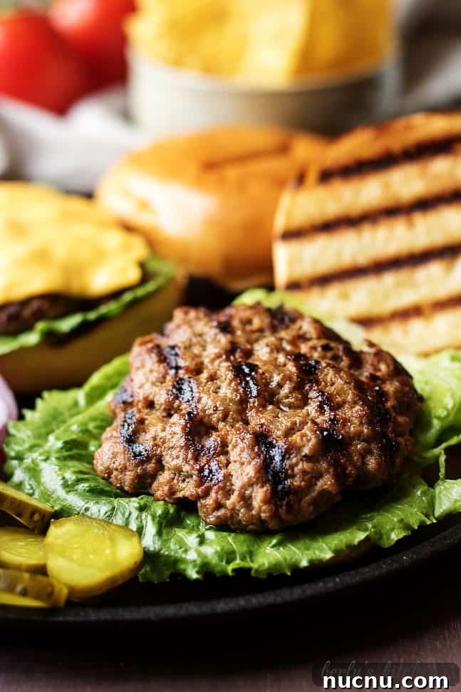Homemade Juicy Hamburgers Recipe for Classic Flavor 5 Open-faced hamburger on a bun.