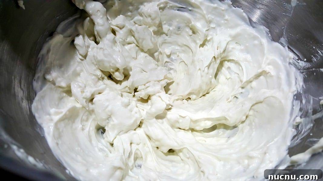 4-Ingredient Beer Cheese Dip Recipe for Game Day 4 Guinness Cheese Dip mixed in a bowl.