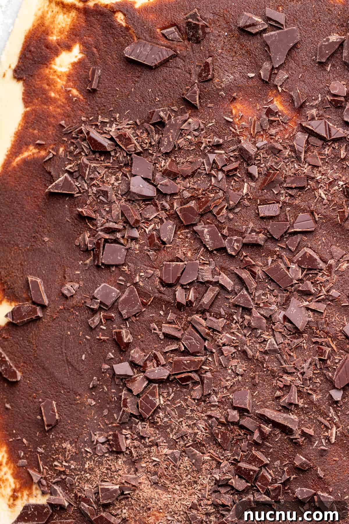 Decadent Chocolate Cinnamon Rolls with Gooey Chocolate Swirl 6 Chopped chocolate on top of dough.