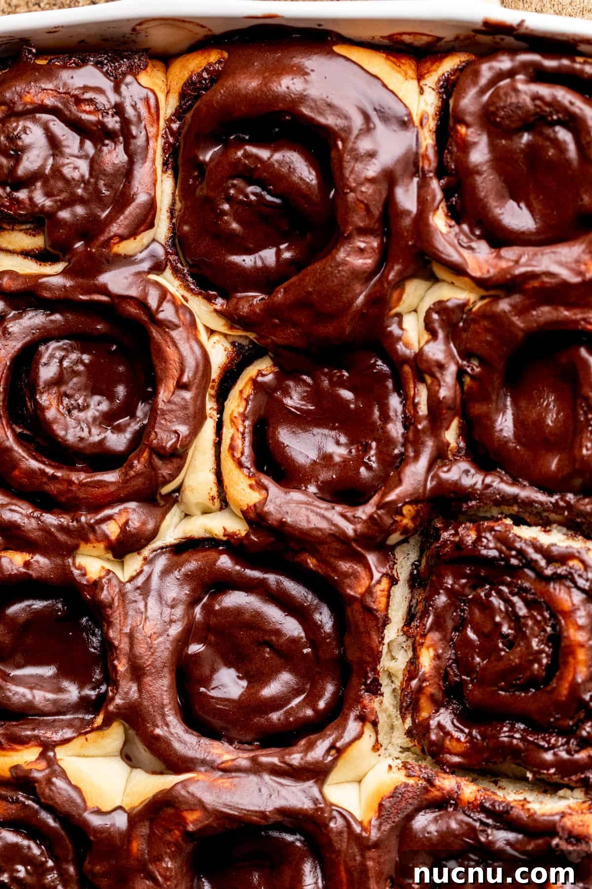 Decadent Chocolate Cinnamon Rolls with Gooey Chocolate Swirl 9 Top view of chocolate cinnamon rolls in the pan.