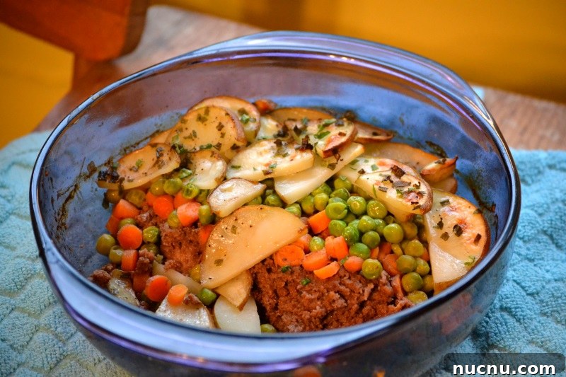 Classic Cottage Pie Recipe: Comforting Beef and Mash Dinner 3 Traditional cottage pie with servings scooped out of dish