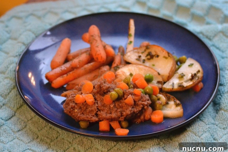 Classic Cottage Pie Recipe: Comforting Beef and Mash Dinner 4 Cottage pie served on blue dish with roast carrots