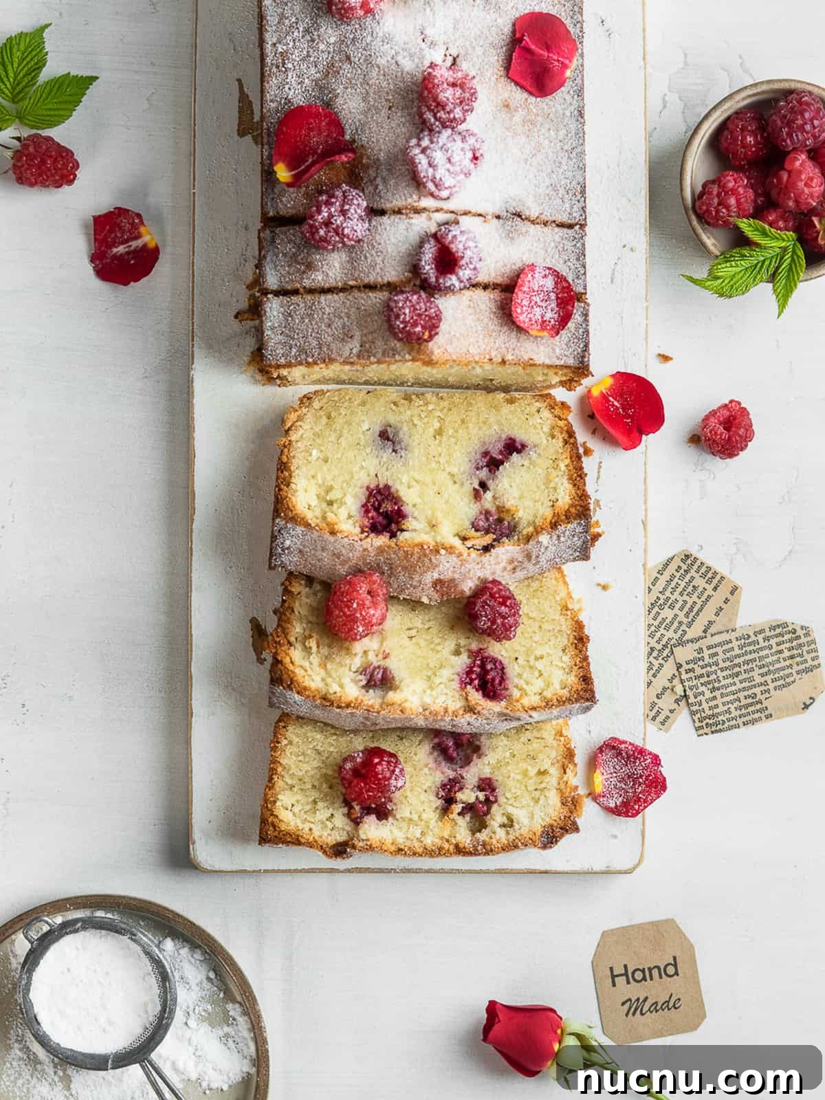 Ispahan Raspberry Loaf Cake Recipe for Elegant Tea-Time Treat 5 Photo of cake sliced and served