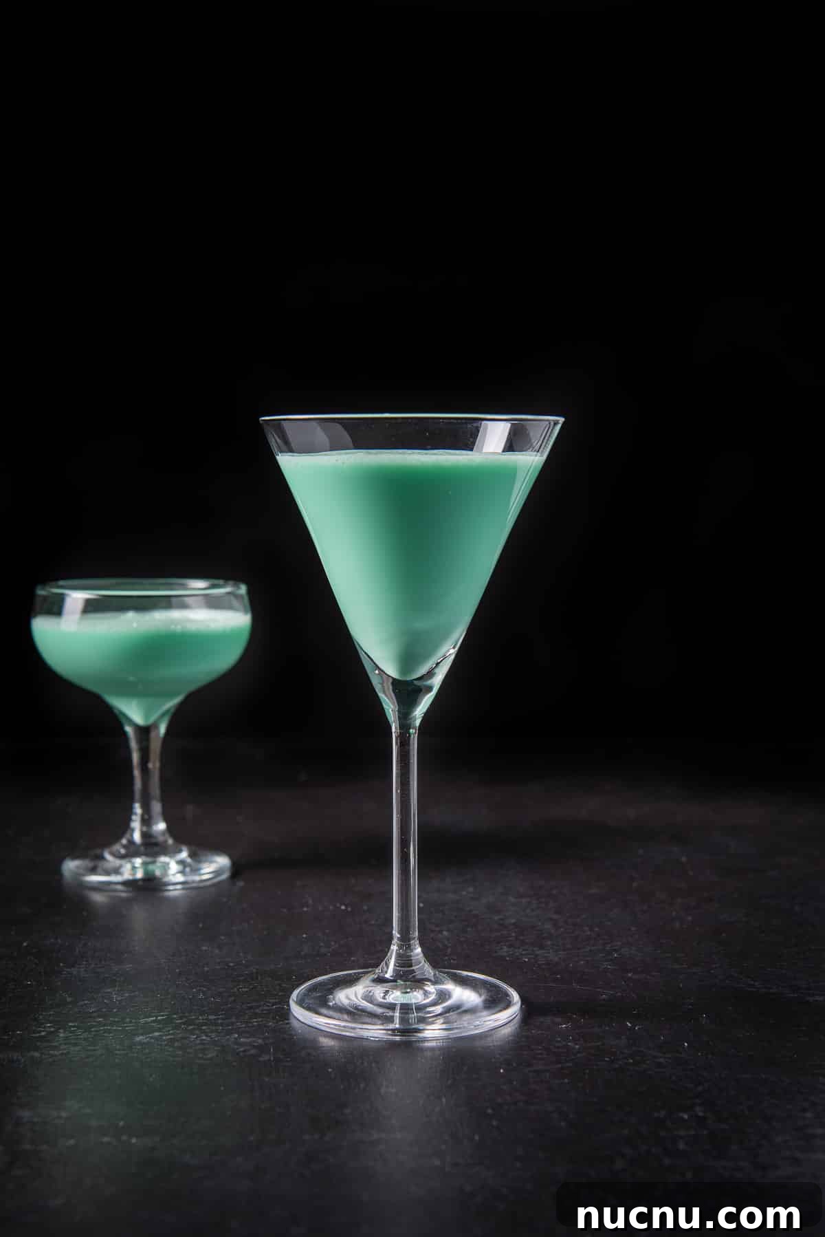 vertical view of the tall martini glass filled with the grasshopper cocktail