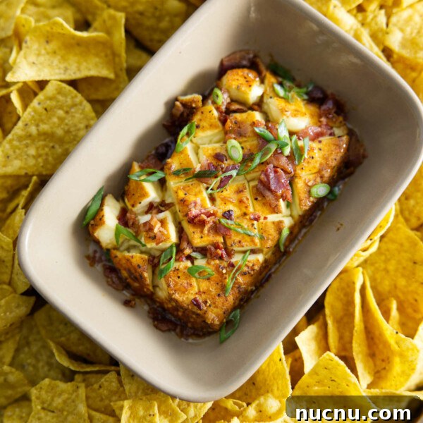 Savory Pork Butt Dry Rub Recipe for Juicy Barbecue 18 smoked cream cheese in dish surrounded by chips and topped with bacon and scallions