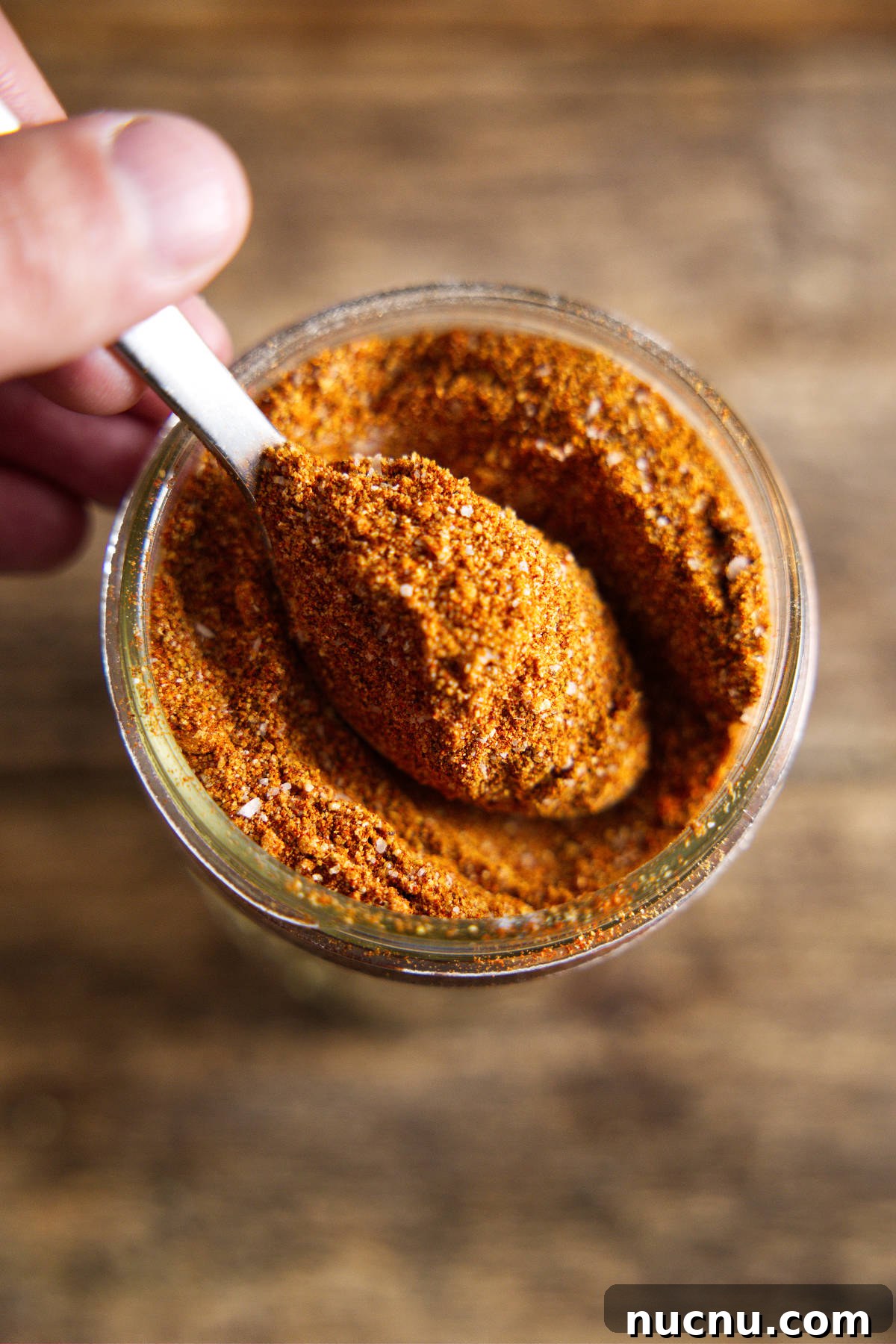 Savory Pork Butt Dry Rub Recipe for Juicy Barbecue 3 spoon full of rub