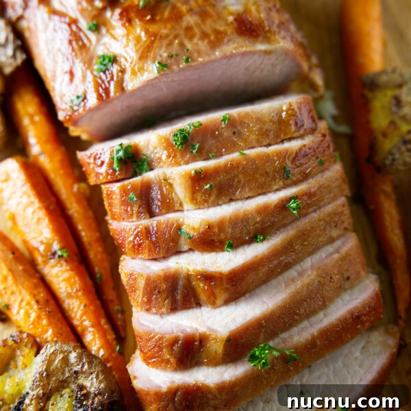 Savory Pork Butt Dry Rub Recipe for Juicy Barbecue 6 sliced whole smoked pork loin on cutting board