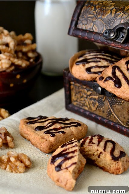 Chewy Oat and Walnut Cookies Recipe 7 oats and walnut cookies on a table.