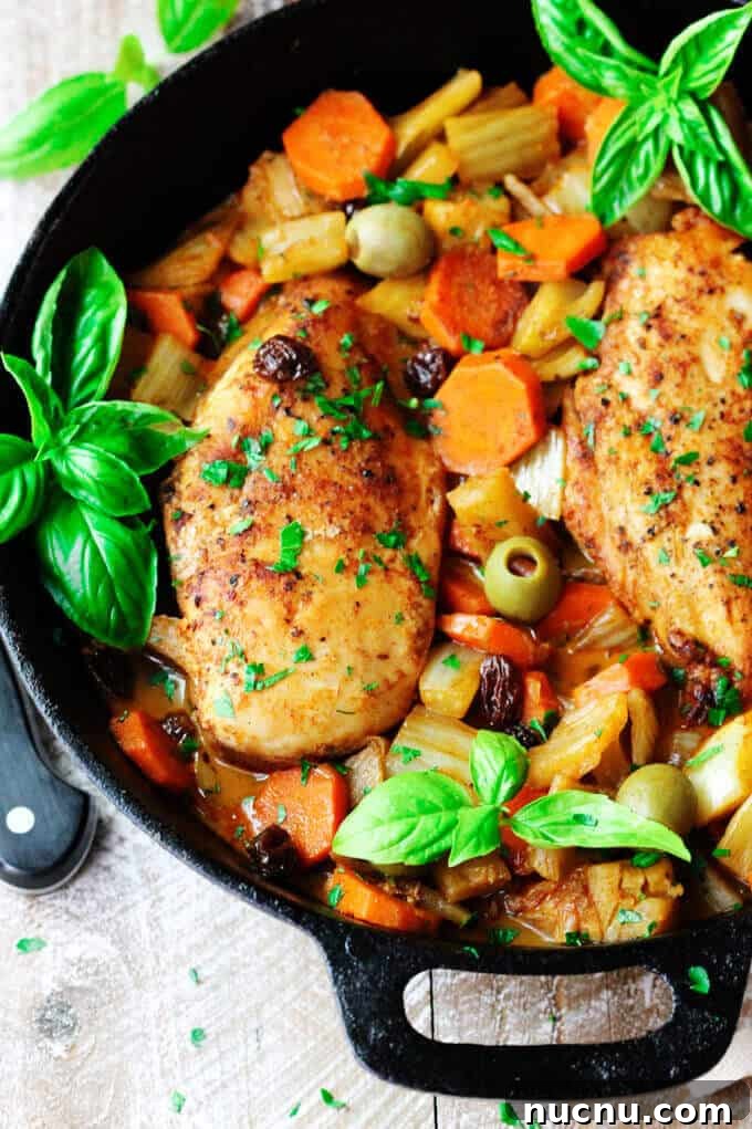 Fennel Chicken Mediterranean Style with carrots, raisins, and olives is a very easy, one-pot meal for any day of the week. It is seasoned with cinnamon, cumin and smoked paprika for an irresistible and flavorful chicken dish. Fennel Chicken Mediterranean Style with carrots, raisins and olives in a skillet