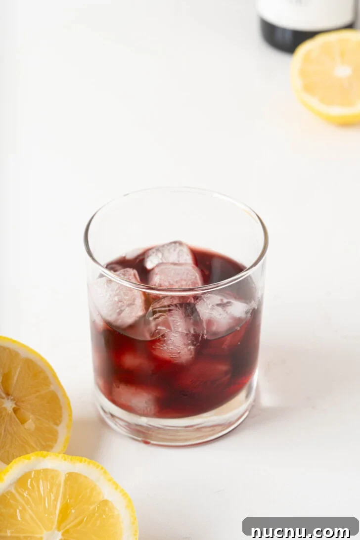 Red wine over ice in a glass.