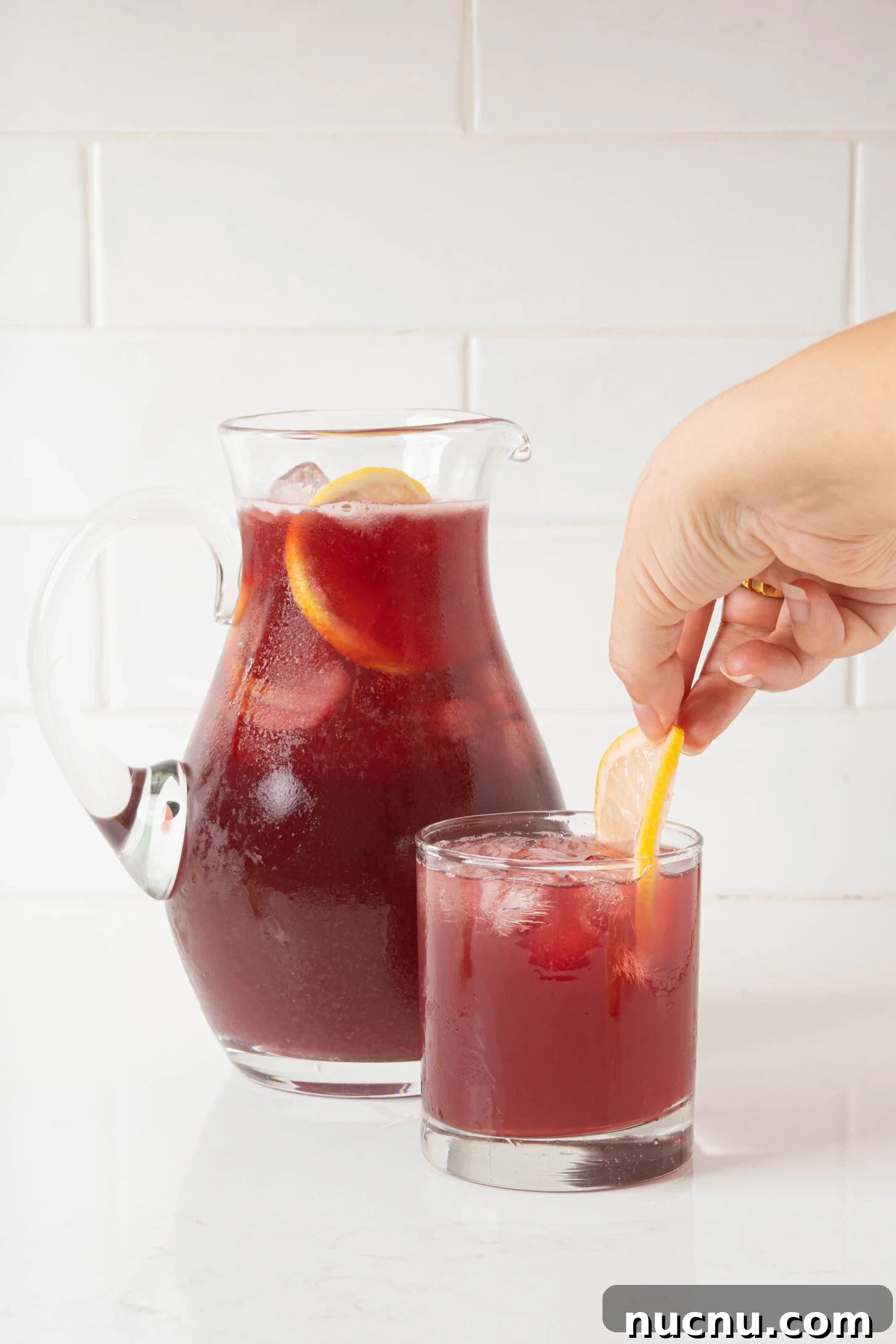 A glass and pitcher of tinto de verano.