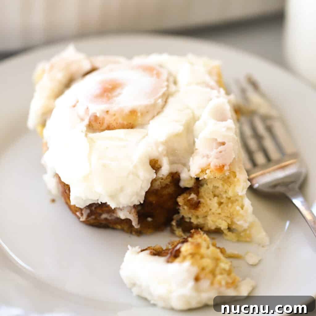 Cinnamon Roll Recipes: Classic, Gooey, and Irresistible Options 5 einkorn cinnamon roll on a white plate with frosting, one of my favorite cinnamon roll variations.