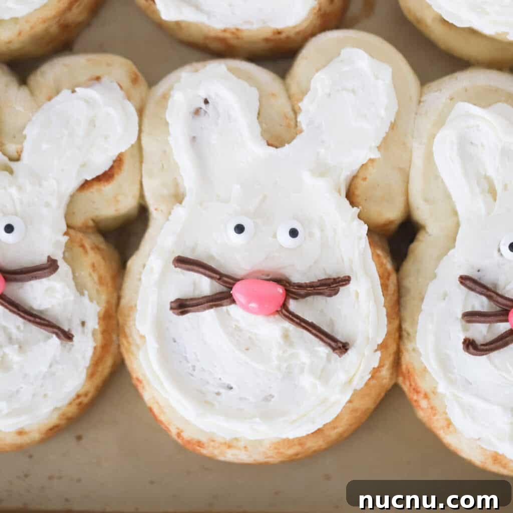 Cinnamon Roll Recipes: Classic, Gooey, and Irresistible Options 8 bunny cinnamon rolls on a baking sheet, easter cinnamon rolls.