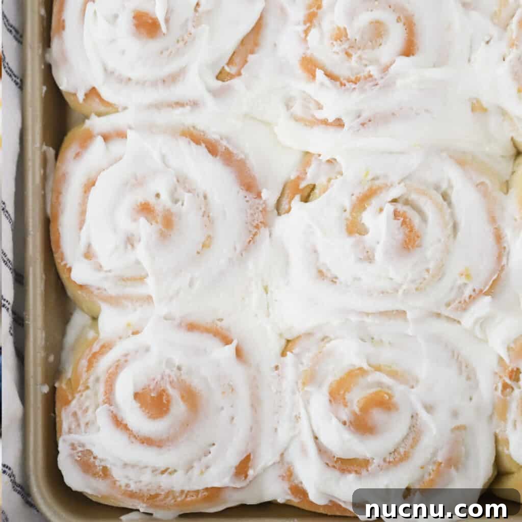 Cinnamon Roll Recipes: Classic, Gooey, and Irresistible Options 10 A sheet tray full of lemon sweet rolls topped with frosting.