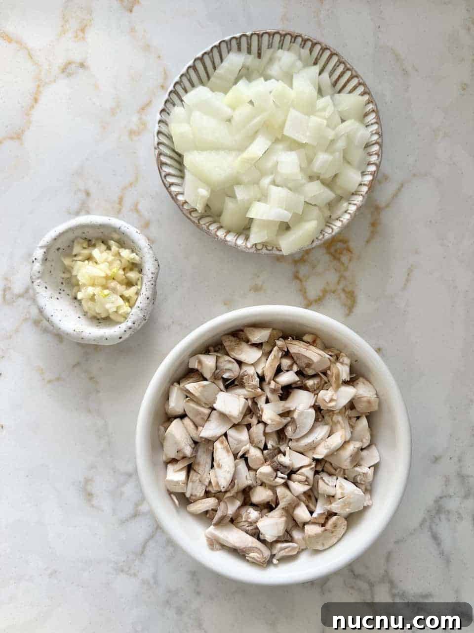 measured out ingredients in a bowl against white background