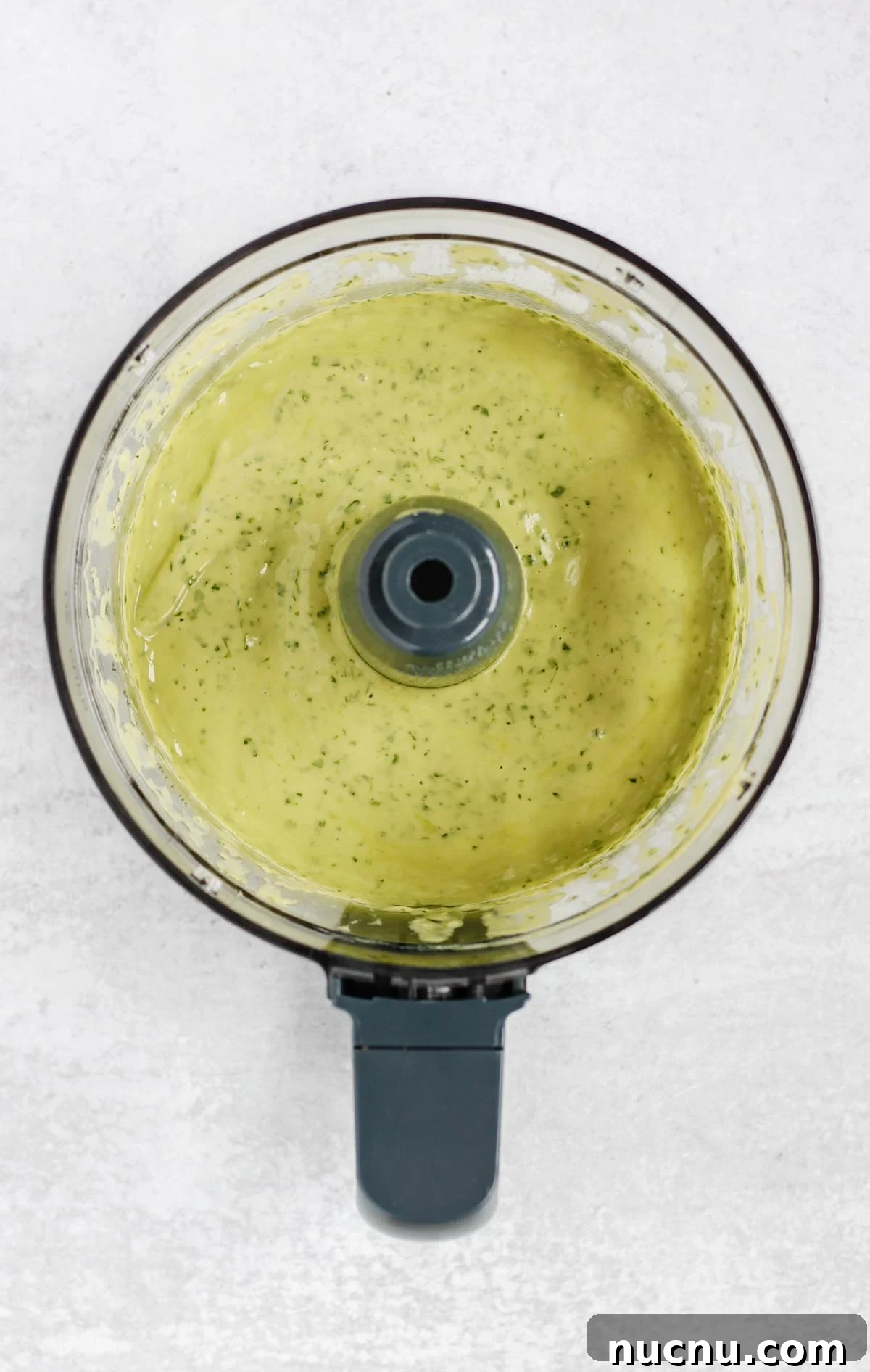 Creamy cilantro lime dressing in a food processor.