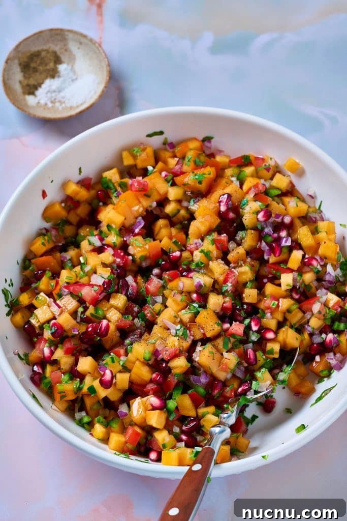 Persimmon Salsa Recipe: Fresh, Tangy Fall Salsa for Chips & Tacos 4 a spoon mixing ingredients of Persimmon salsa.