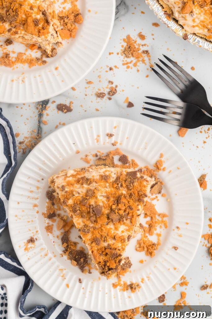 Decadent Butterfinger Pie Recipe — How to Make It at Home 10 Slice of pie on a plate.