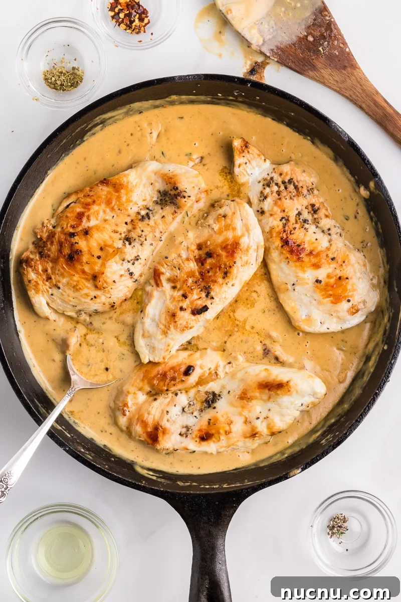 Pan with marry me chicken breasts in a parmesan tomato sauce.