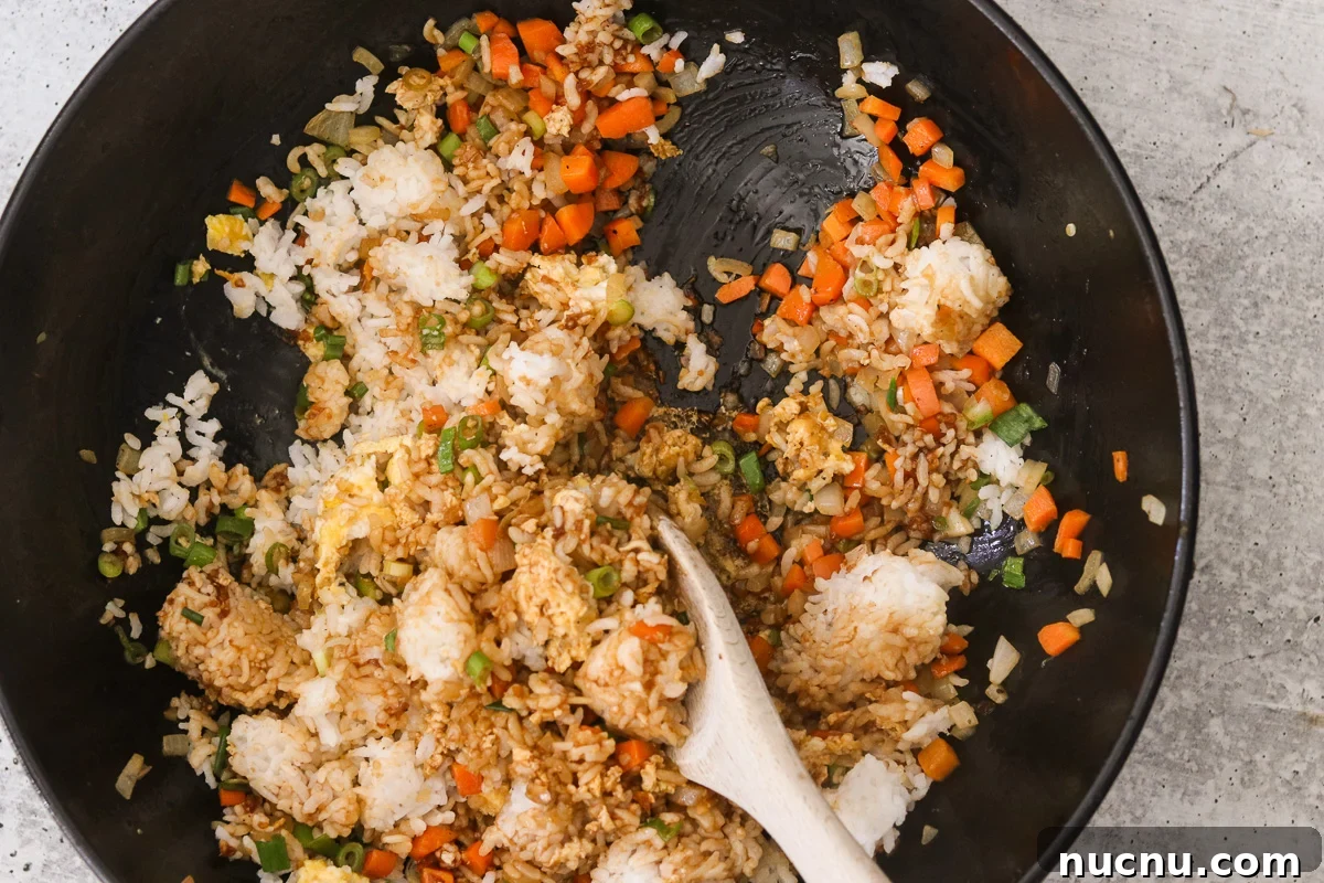 Hibachi Chicken Bowl Recipe — Japanese Steakhouse Copycat 8 Cold rice, green onions, and hibachi sauce stirred into the skillet with the eggs and vegetables.