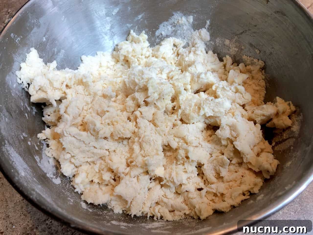Flaky All-Butter Pie Crust Recipe for Perfect Homemade Pies 6 pie crust dough with water added.