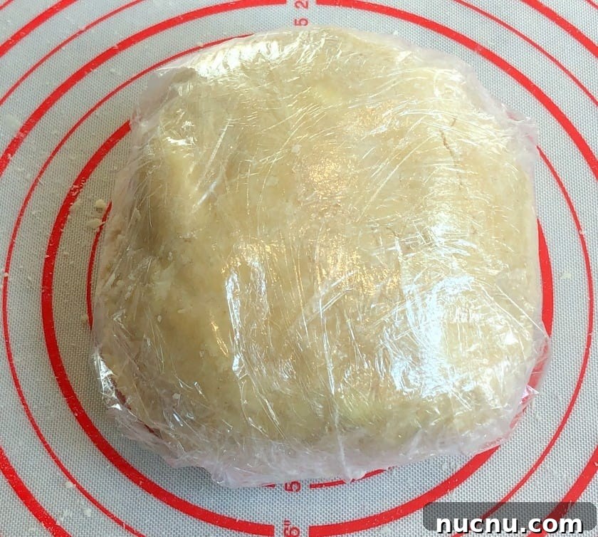 Flaky All-Butter Pie Crust Recipe for Perfect Homemade Pies 8 pie crust discs wrapped in plastic wrap.