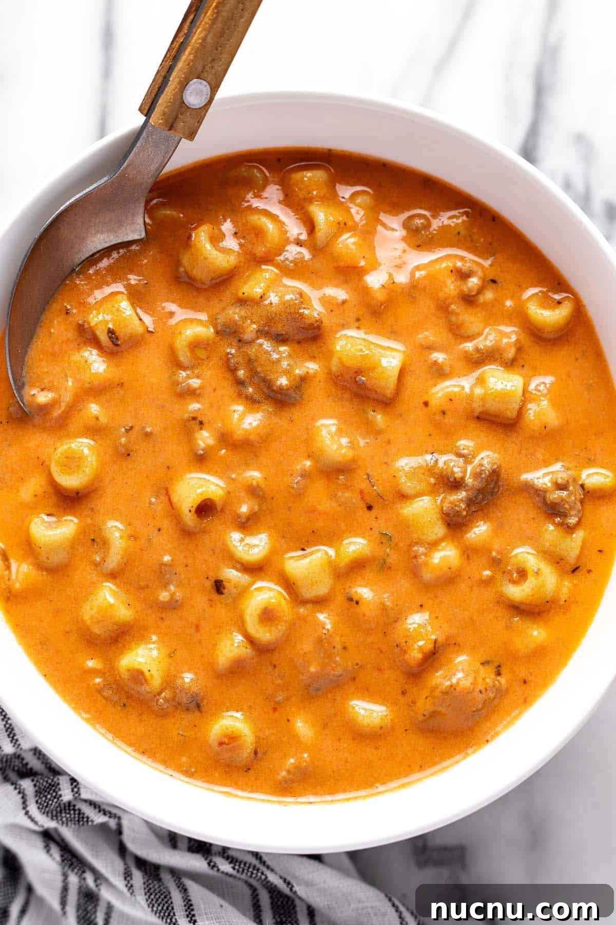 Creamy Beef and Tomato Noodle Soup Recipe 2 Bowl of creamy tomato soup with ground beef and noodles.