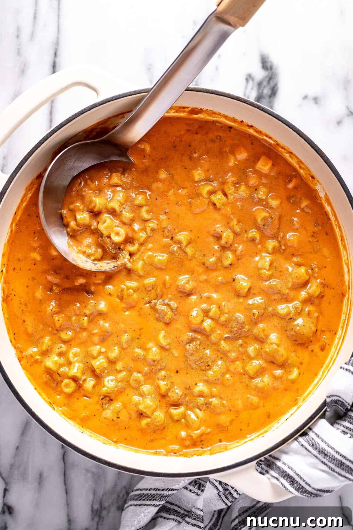 Creamy Beef and Tomato Noodle Soup Recipe 8 Large pot filled with creamy tomato soup with ground beef and noodles.