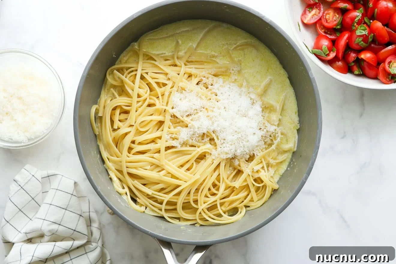 Lemon Pasta with Cherry Tomatoes and Fresh Basil Recipe 6 adding pasta to sauce in pot