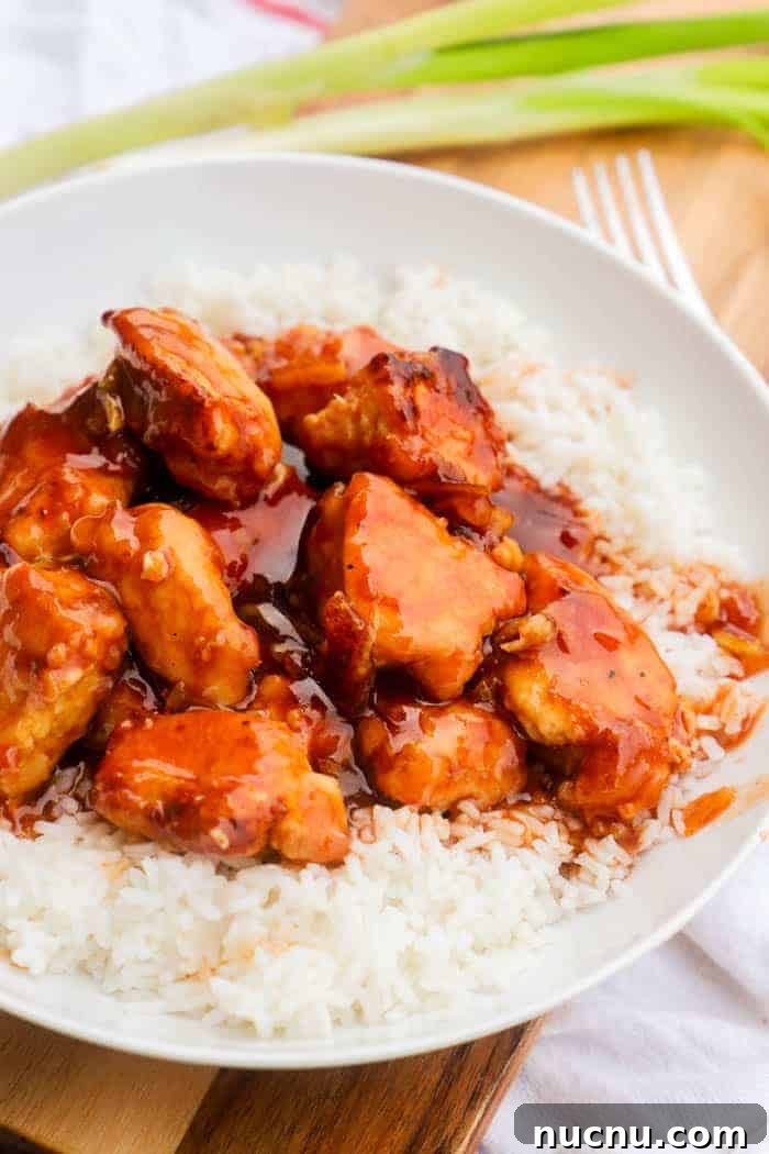 Sticky Orange Chicken Recipe: Crispy, Tangy Takeout at Home 2 Easy Orange Chicken in a white bowel