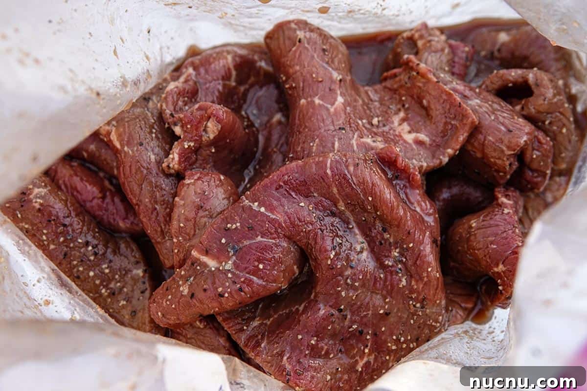 Kentucky Bourbon–Glazed Beef Jerky Recipe 6 bourbon beef jerky marinating in ziplock bag