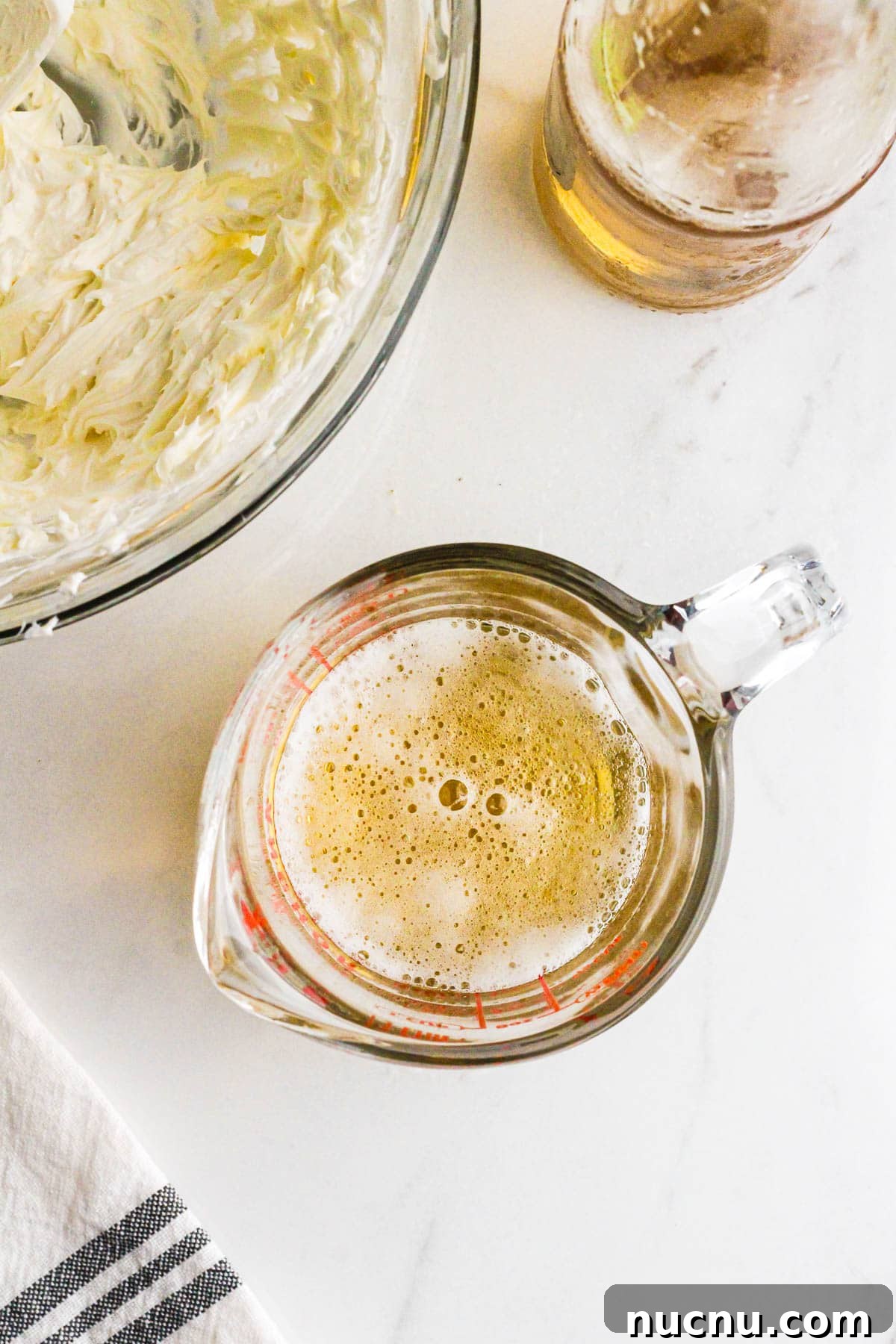 Light beer in a measuring cup