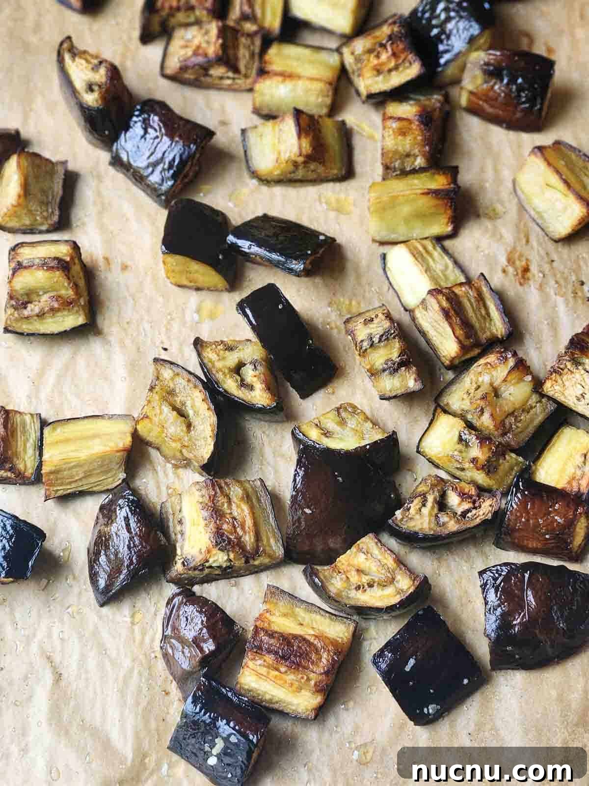 Sicilian Eggplant Caponata Recipe: Sweet-Sour Mediterranean Relish 5 Roasted eggplant on parchment paper.