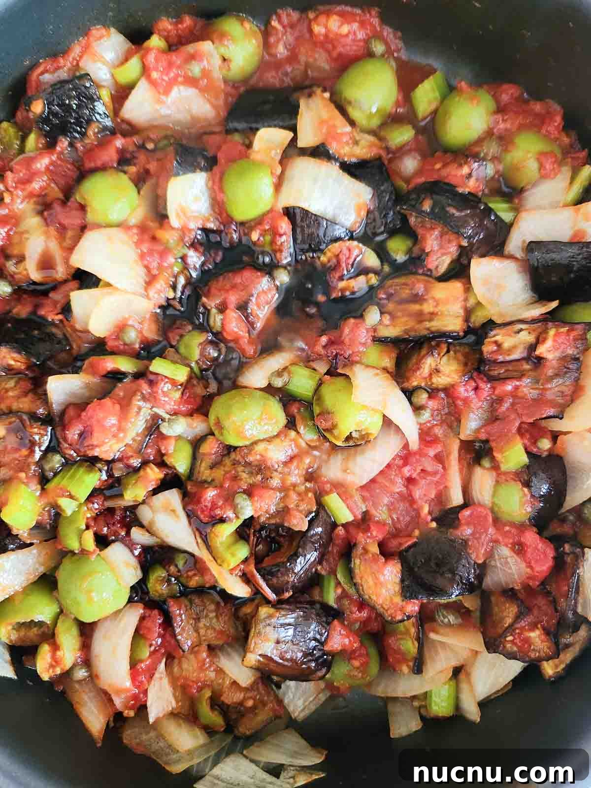 Sicilian Eggplant Caponata Recipe: Sweet-Sour Mediterranean Relish 7 Caponata ingredients mixed in a pan.