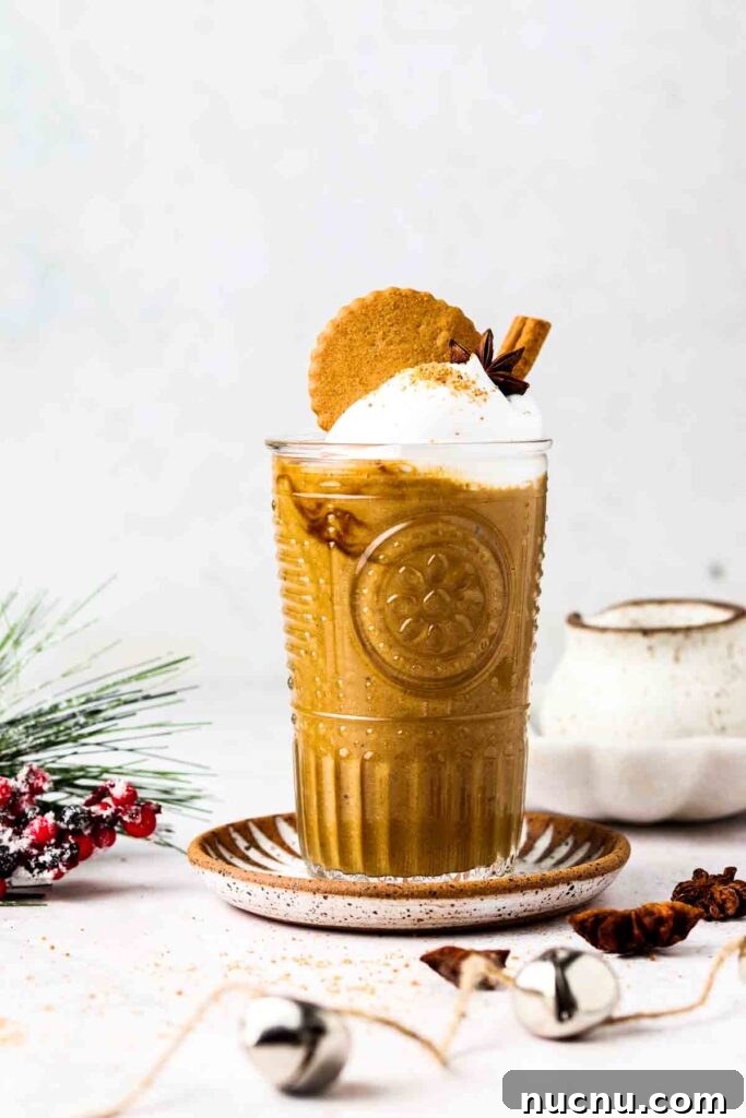dairy free gingerbread smoothie 2 brown smoothie with a gingerbread cookie on top