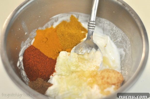 Tandoori Chicken marinade Tandoori spices mixed with plain yogurt in a small bowl.