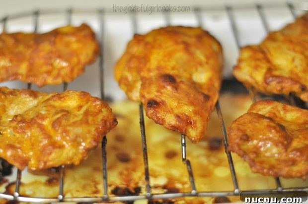 Tandoori Chicken under broiler Broiling the tandoori chicken under the oven broiler.