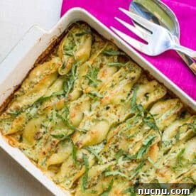 Ultimate Baked Pasta Recipes for Crowd-Pleasing Dinners 15 Baked spinach and cheese stuffed shells in baking dish.