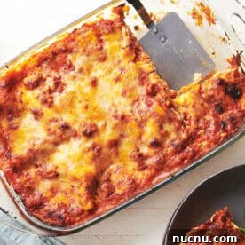 Ultimate Baked Pasta Recipes for Crowd-Pleasing Dinners 6 Turkey lasagna in pan on table.