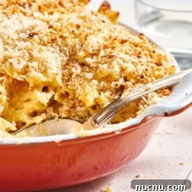 Ultimate Baked Pasta Recipes for Crowd-Pleasing Dinners 10 Baked Macaroni and Cheese in red baking dish.