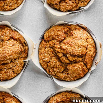 Baked pumpkin muffins in a muffin tin.