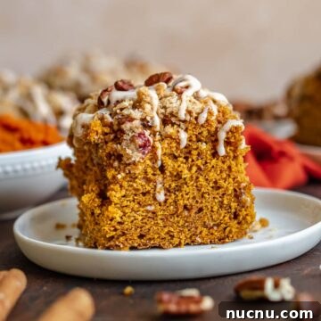 Slice of pumpkin coffee cake on a plate.