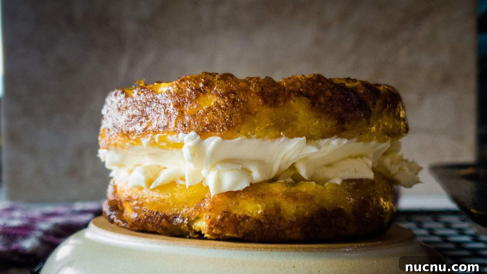 A picture of a two Ingredient English Muffins with cream cheese.