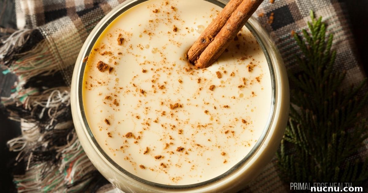 A serving of eggnog in a round glass.
