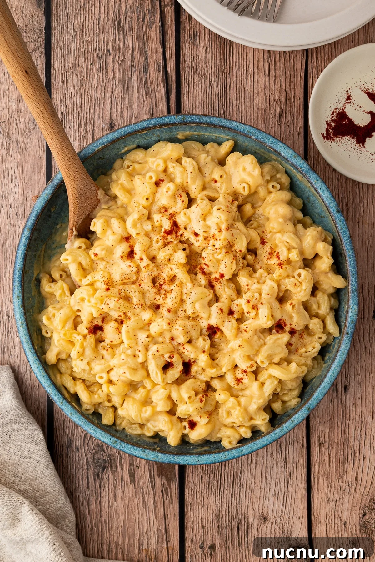 Creamy Stovetop Monterey Jack Mac and Cheese Recipe 3 Smoked paprika generously sprinkled over prepared Mac and cheese in stoneware bowl.
